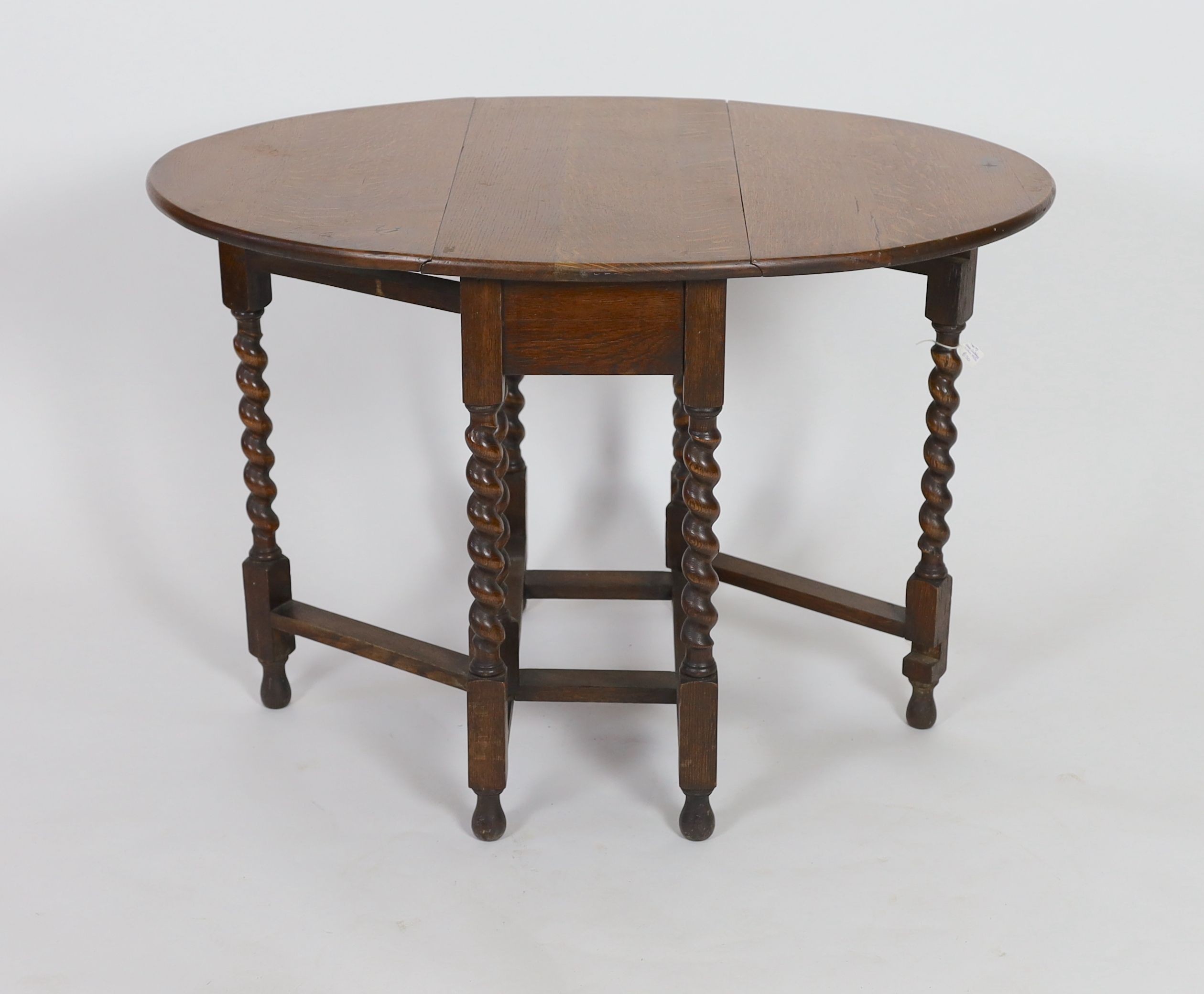 A small early 20th century oak gateleg table, on spiral turned legs, width 77cm depth 37cm height 74cm
